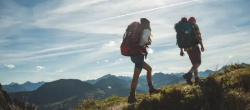 hiking uphill with backpacks